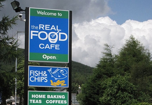 Signpost at the real food cafe in tyndrum